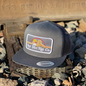RED DIRT CAPS: SUNSET PATCH CHARCOAL / CHARCOAL EXCLUSIVELY TO BOTAS ROJERO